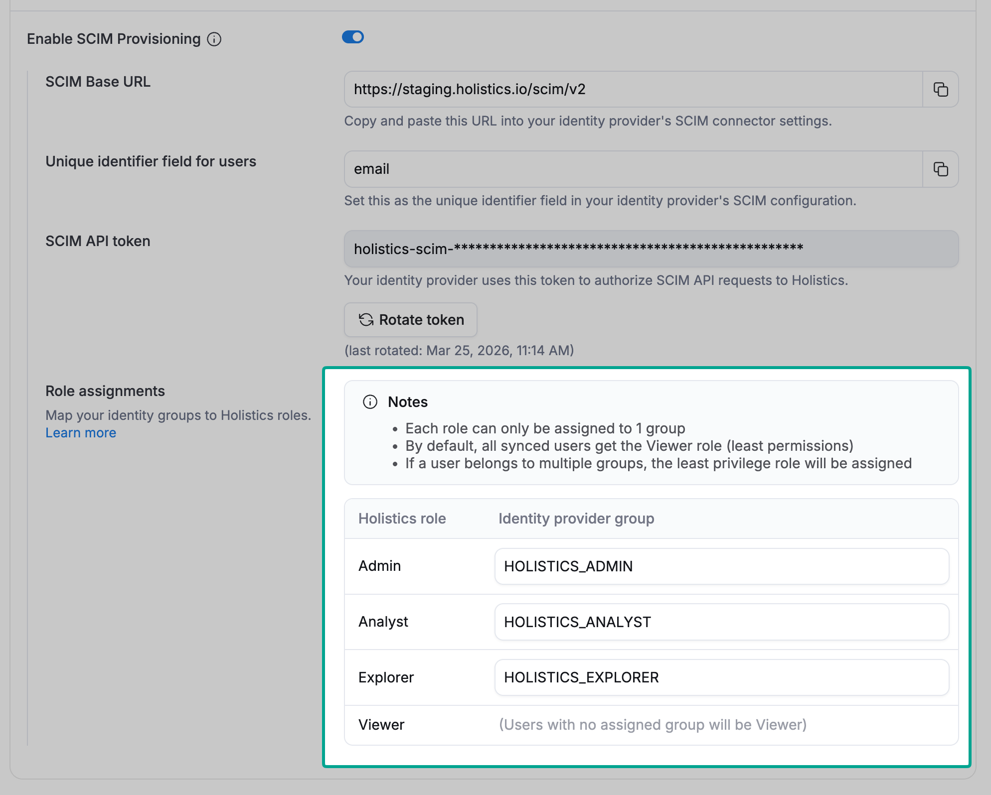Group-to-role mapping configuration in Holistics, showing IdP groups being mapped to Holistics roles like Admin, Analyst, and Explorer.