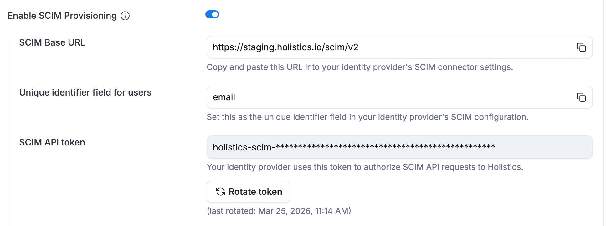 SCIM provisioning settings in Holistics, showing the toggle to enable it, the SCIM Base URL, and the SCIM API Token.